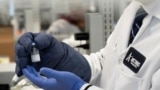 A frozen sample of an RNA vaccine for the novel coronavirus (COVID-19) is displayed by Arcturus Therapeutics CEO Joe Payne at one of the company's laboratories in San Diego, California, March 17, 2020.