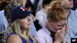 A woman weeps as election results are announced during Democratic presidential nominee Hillary Clinton's election night rally in the Jacob Javits Center glass enclosed lobby in New York, Nov. 8, 2016.