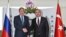 Russian Foreign Minister Sergei Lavrov, left, and Turkish Foreign Minister Mevlut Cavusoglu shake hands before a meeting of Turkey-Russia joint strategic planning group in Alanya, Antalya, Turkey, Dec. 1, 2016. 