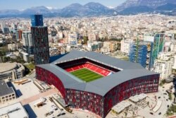 FILE - An aerial view of Tirana, Albania, with the 'Air Albania' stadium in foreground, March 26, 2021. Picture taken with a drone.