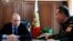 FILE - Russian President Vladimir Putin, left, and Commander-in-Chief of the Interior Ministry troops Viktor Zolotov attend a meeting in the Kremlin in Moscow, Russia, April 5, 2016.