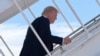Republican presidential candidate and former President Donald Trump boards his plane at Palm Beach International Airport on July 27, 2024, in West Palm Beach, Florida. Trump is headed to appearances Tennessee and Minnesota.