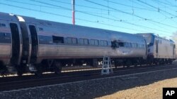 This photo shows an Amtrak train following an accident Sunday, April 3, 2016, in Chester, Pennsylvania. Amtrak said the train was heading from New York to Savannah, Ga., when it struck a backhoe outside of Philadelphia. 