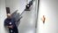 Image provided by FBI shows Aaron Alexis carrying a Remington 870 shotgun through hallways of building #197 at Washington Navy Yard, Sept. 16, 2013.