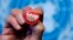 File - A pin reading "Stop TB" is shown after presentation of WHO report Global Tuberculosis Control at the United Nations headquarters, Geneva, Switzerland