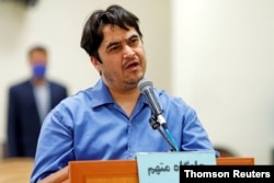 FILE - Ruhollah Zam, a dissident journalist who was captured in what Tehran calls an intelligence operation, speaks during his trial in Tehran, Iran, June 2, 2020. (Mizan News Agency/WANA)