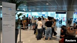 Passengers at an Air France ticketing counter at the Nice Cote d'Azur international airport in Nice, Sept. 27, 2014.