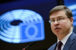 FILE - European Commission Vice President Valdis Dombrovskis speaks at the European Parliament in Brussels, Belgium, March 10, 2021.