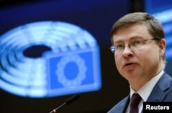 FILE - European Commission Vice President Valdis Dombrovskis speaks at the European Parliament in Brussels, Belgium, March 10, 2021.