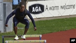 U.S. runner Lauryn Williams trains for the 2012 Summer Olympics, in Birmingham, England, July 23, 2012.