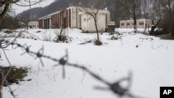 In this file photo dated March 7, 2015, a now abandoned warehouse where hundreds of Muslim Bosniak men and boys are known to have been killed in July 1995 in the village of Kravica on the outskirts of Srebrenica. 