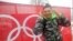 Atlet Timor Leste Yohan Goutt Goncalves berpose di Olimpiade Musim Dingin Sochi 2014 di Rusia. (AP/Christophe Ena)