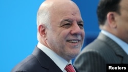 Iraqi Prime Minister Haider al-Abadi arrives for the second day of a NATO summit in Brussels, Belgium, July 12, 2018. 