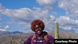 University of Arizona conservation biology graduate student Earyn McGee visits Saguaro National Park, Arizona. (Photo courtesy of Earyn McGee/Katherine Kennedy)