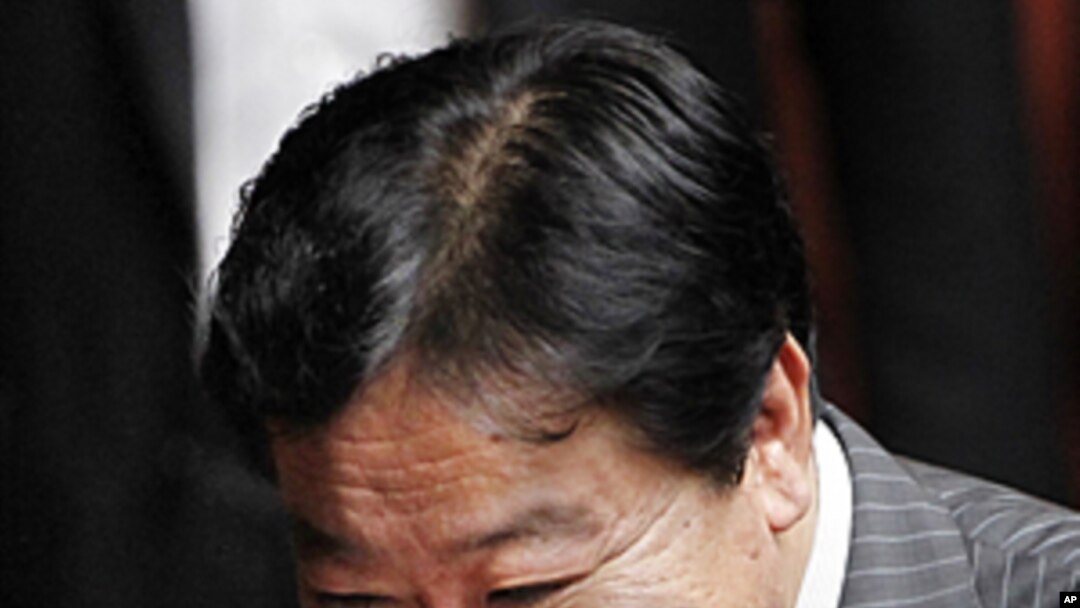 Yoshihiko Noda, new leader of the ruling Democratic Party of Japan, reacts before Japan's lower house elected Noda as the country's new prime minister, at the parliament in Tokyo, August 30, 2011
