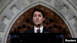 FILE - Canada's Prime Minister Justin Trudeau, shown participating in a news conference in Ottawa last month, stressed the importance of U.S.-Canada ties in a video address to the new Congress in Washington. 