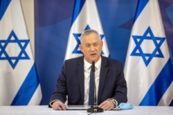 FILE - Israel's Alternate Prime Minister and Defense Minister Benny Gantz issues a statement at the Israeli Defense Ministry in Tel Aviv, Israel, July 27, 2020.