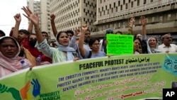 FILE - Members from Pakistan's minority community and civil society chant slogans during a demonstration against the conviction of a Christian man on charges of blasphemy and condemn the country's blasphemy laws, July 2, 2024. 