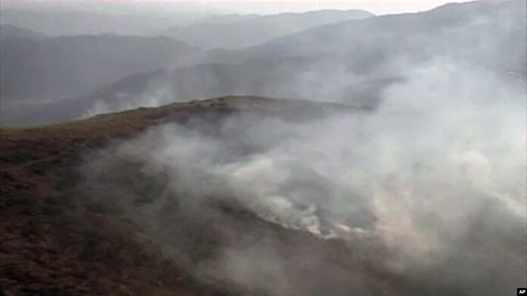 An image taken from an Inter Services Public Relations video shows smoke billowing from army posts after a NATO attack in the Pakistan-Afghanistan border area, November 30, 2011