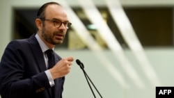 FILE - French Prime Minister Edouard Philippe addresses the National Assembly in Paris, Jan. 22, 2018. 