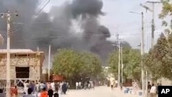 FILE - In this grab taken from video, smoke billows after an explosion in Beledweyne, Somalia, Saturday, Sept. 23, 2023. An explosives-laden vehicle has detonated at a security checkpoint in the central Somalia city of Beledweyne.