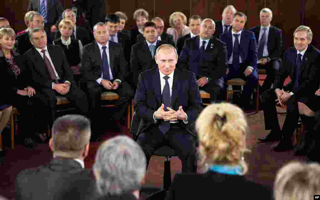 December 6: Prime Minister Vladimir Putin speaks during a meeting with supporters in Moscow. (AP/Misha Japaridze)
