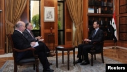 Suriya prezidenti Bashar Assad argentinalik jurnalistlar bilan, 18-may, 2013-yil.