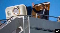 President Barack Obama waves as he arrives at Kenyatta International Airport, on Friday, July 24, 2015, in Nairobi, Kenya. Obama is traveling on a two-nation African tour where he will become the the first sitting U.S. president to visit Kenya and Ethiopia. (AP Photo/Evan Vucci)