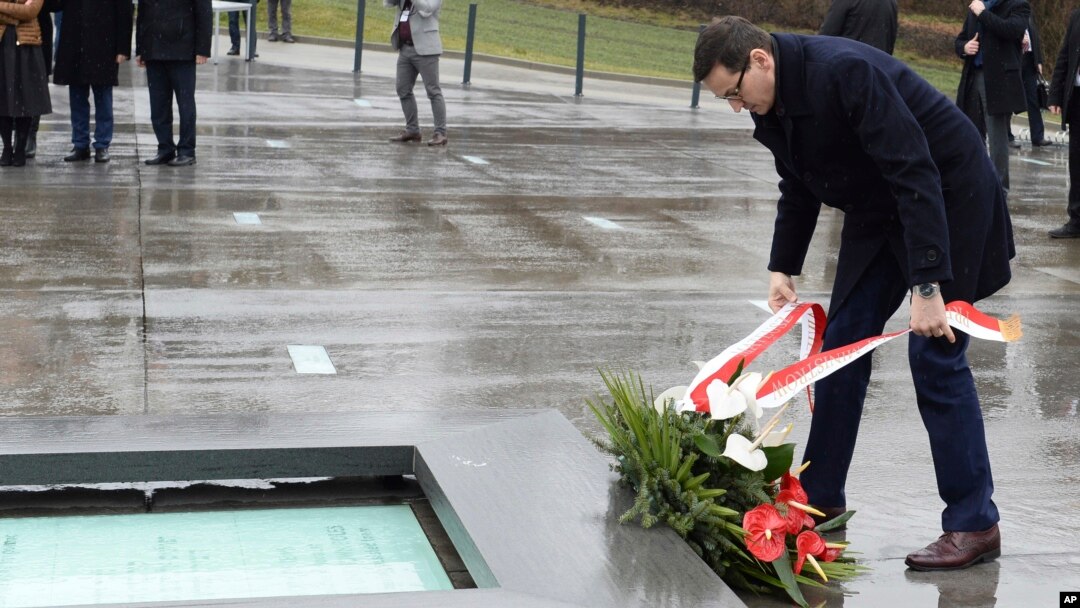 Polish Prime Minister Mateusz Morawiecki lays a wreath as he visits the Ulma Family Museum of Poles Who Saved Jews during WWII, in Markowa, Poland, Feb. 2, 2018. 