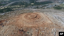 FILE - In this undated photo provided by the Greek Culture Ministry on Tuesday, June 11, 2024, the ruins of a 4,000-year-old hilltop building newly discovered on the island of Crete are seen from above. (Greek Culture Ministry via AP)