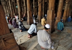 Muslims pray as they maintain social distancing inside Juma Masjid in Ahmedabad after the opening of most of the religious places as India eases lockdown restrictions, June 8, 2020.