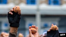 Protesters holding eggs with messages to coincide with Easter Sunday during a demonstration against the military coup in Taunggyi in Myanmar&#39;s Shan state. (Handout / Anonymous)