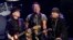 FILE - Bruce Springsteen, center, performs with Nils Lofgren, left, and Steven Van Zandt of the E Street Band during their concert at the Los Angeles Sports Arena in Los Angeles, March 15, 2016. The band's Sept. 7 concert in Philadelphia topped four hours.