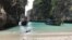 FILE - Long-tail boats sit near a small beach on Ko Phi Phi Leh, an island off the southwestern coast of Thailand, Dec. 5, 2016. The smaller of the Phi Phi Islands is a tourist hotspot for its beautiful water, party atmosphere and famed Maya Bay, where the movie "The Beach" was filmed. 