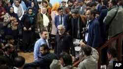 Afghan presidential candidate Abdullah Abdullah, center, arrives for a gathering in Kabul, Afghanistan, Nov. 10, 2019. 