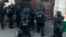 In this UGC image made from a mobile phone, police in riot gear surrounded the entrance of a building in central Paris where a man is believed to be holding two people hostage, in Paris, June 12, 2018. 