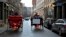 Two horse-drawn carriages pass in Old Montreal, Quebec, Canada, Dec. 22, 2019. Montreal's horse-drawn carriages will be taken off the roads Dec. 31, ending a feud between the city and coachmen and a quaint means of local travel that dates to the 1600s.