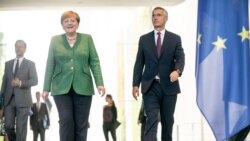 German Chancellor Angela Merkel and NATO Secretary General Jens Stoltenberg arrive at chancellery in Berlin, Germany, Aug. 27, 2020.