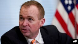 FILE - Budget Director Mick Mulvaney speaks during a meeting in the Eisenhower Executive Office Building on the White House complex in Washington, May 25, 2017.