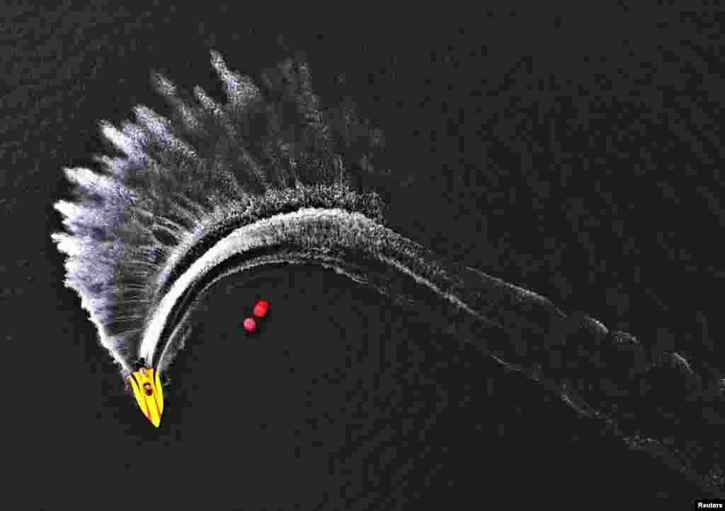 An aerial view shows a speed boat competing during the Russian powerboat championship on the Yenisei River in Krasnoyarsk, Siberia, July 1, 2017.