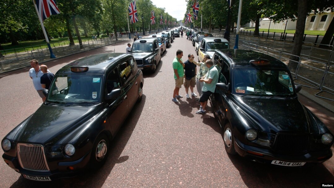 Taxi drivers demonstrate along the Mall, central London, June 11, 2014.