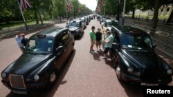 Taxi drivers demonstrate along the Mall, central London, June 11, 2014.