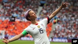 FILE - United States' Megan Rapinoe celebrates after scoring the opening goal from the penalty spot during the Women's World Cup final soccer match between US and The Netherlands at the Stade de Lyon in Decines, outside Lyon, France, July 7, 2019.