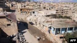 FILE - A general view shows damaged buildings in the town of Darat Azzah, west of the northern Syrian city of Aleppo, following reported bombings by government forces, Oct. 7, 2015. 