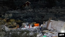 Rescue workers are seen at the landslide in Ask, Gjerdrum, on Jan. 3, 2021.