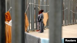 Women are seen as they are held in the Ponte Galeria detention center for migrants near Rome, May 6, 2017. 