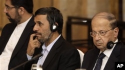 From right, Lebanese Christian leader Michel Aoun, Iranian President Mahmoud Ahmadinejad and Iranian ambassador to Lebanon Ghadanfar Rukun Abadi, listen during a meeting between Ahmadinejad and Lebanese politicians at a hotel in Beirut, Lebanon, Thursday,