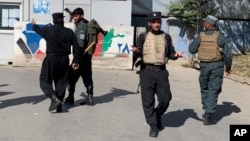 Afghan police arrive at the site of an attack at Kabul University in Kabul, Afghanistan, Monday, Nov. 2, 2020. Gunfire erupted at the university in the Afghan capital early Monday and police have surrounded the sprawling campus, authorities said. …