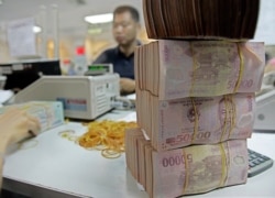 Vietnamese money Dong is seen in Asia Commercial Bank in Hanoi, Vietnam.