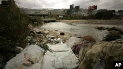 Garbage lies on the banks of a river flowing into the Mediterranean Sea in Dbayeh, north of the Lebanese capital Beirut, on 16 Mar 16, 2010